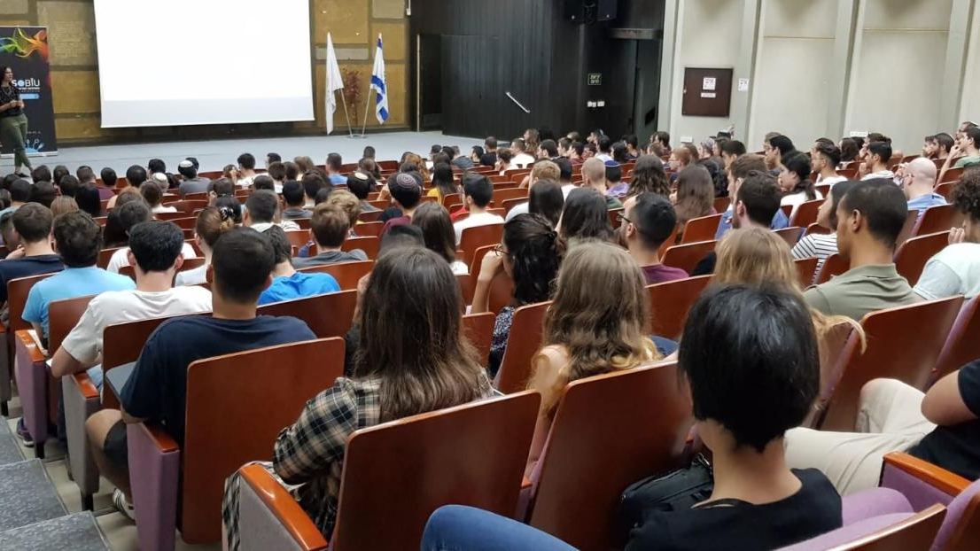 A packed lecture hall during a department event