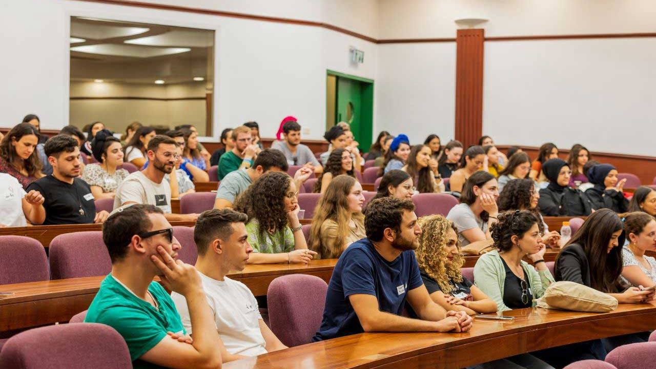 Students listening to a lecture in a large Bar-Ilan lecture hall